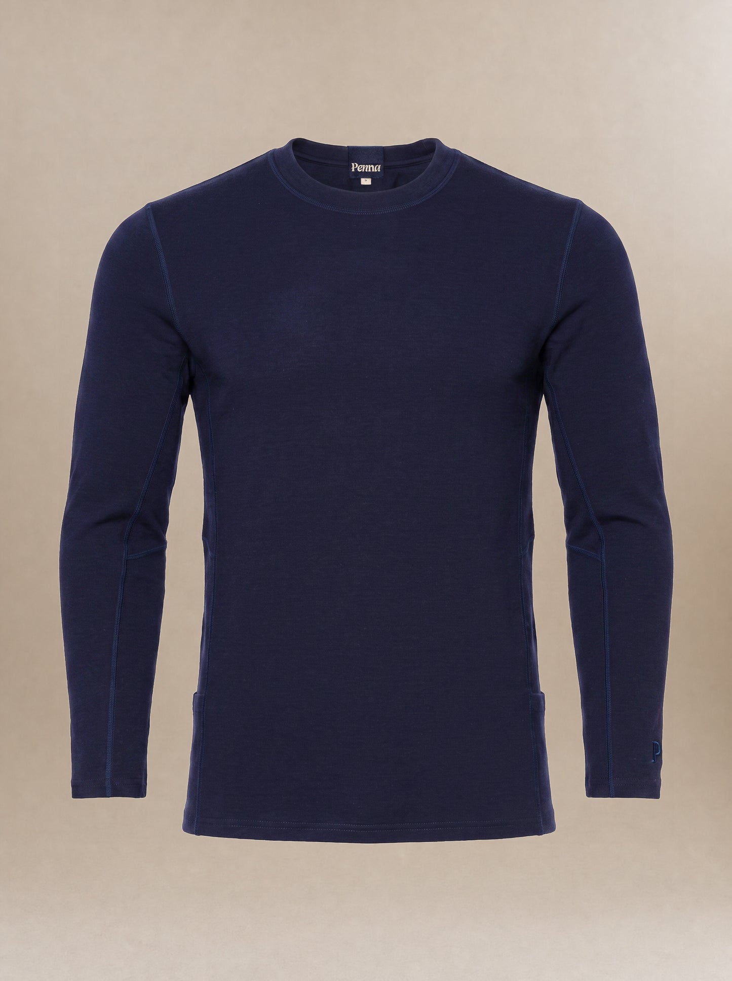 A men's, navy blue long-sleeve crewneck subscrub top displayed on a neutral beige background.