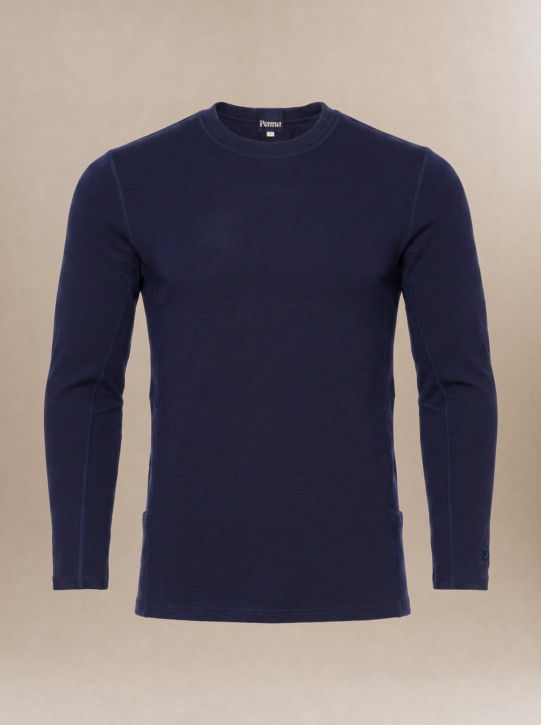 A men's, navy blue long-sleeve crewneck subscrub top displayed on a neutral beige background.
