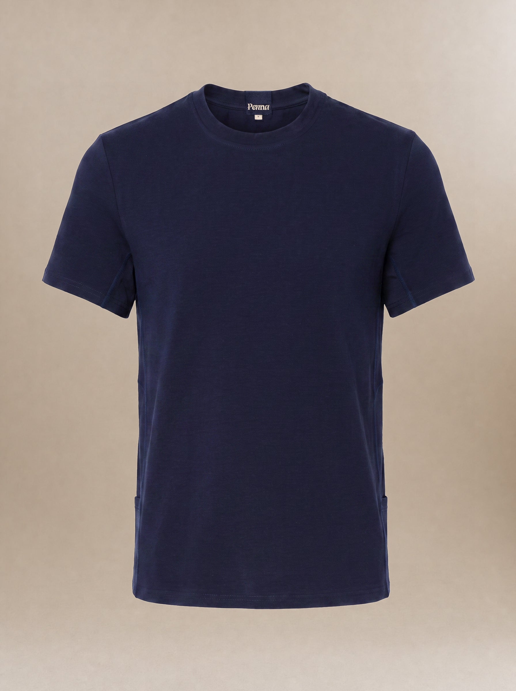 A navy blue short-sleeve crewneck subscrub shirt displayed on a neutral beige background.