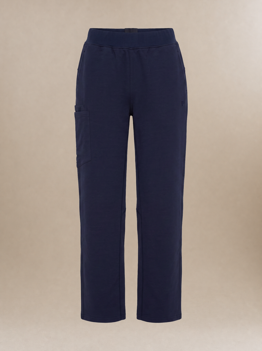 Navy blue, straight-legged women's scrub pants against a light beige background.
