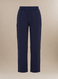 Navy blue, straight-legged women's scrub pants against a light beige background.