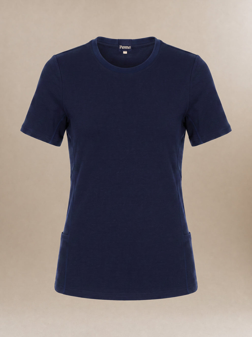 A navy blue short-sleeve crewneck underscrub t-shirt with a fitted silhouette and side pockets, displayed on a neutral beige background.