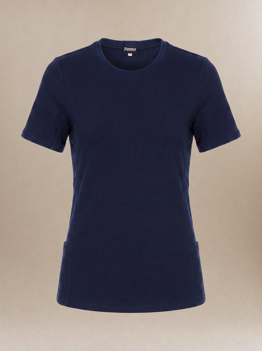 A navy blue short-sleeve crewneck subscrub t-shirt with a fitted silhouette and side pockets, displayed on a neutral beige background.